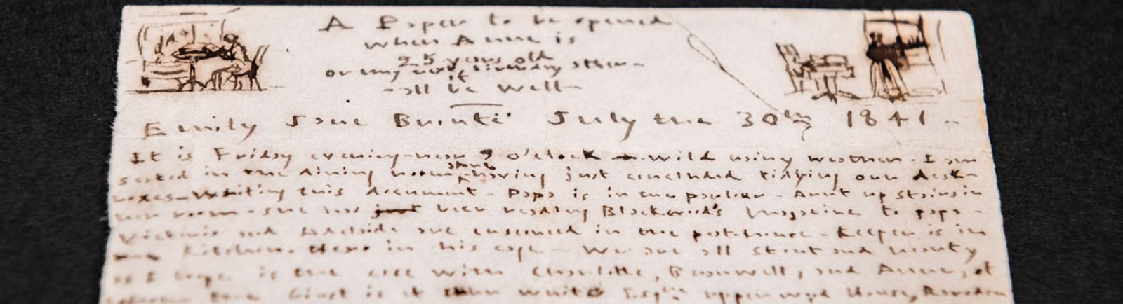 Photo of a yellowed, handwritten diary page including sketches.