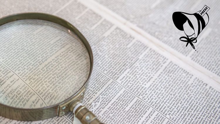 A newspaper and magnifying glass.