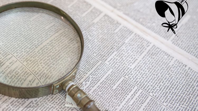 A newspaper and magnifying glass.