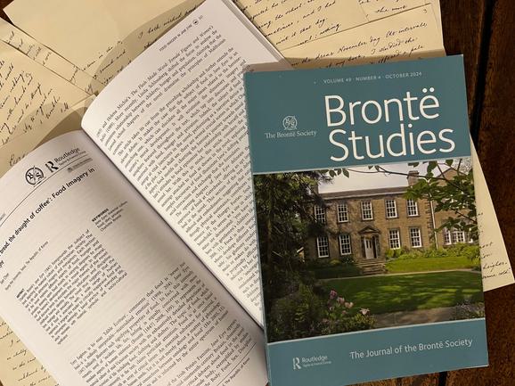 A paper copy of the Bronte Studies magazine on the dining table.
