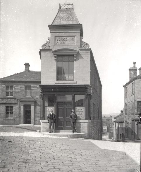 Black and white photo of a building, with an engraving on the facade reading 'Yorkshire Penny Bank'.