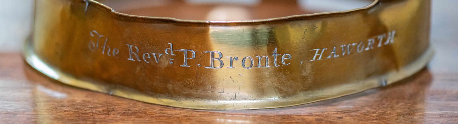 Photo of an inscribed, bronze dog collar.