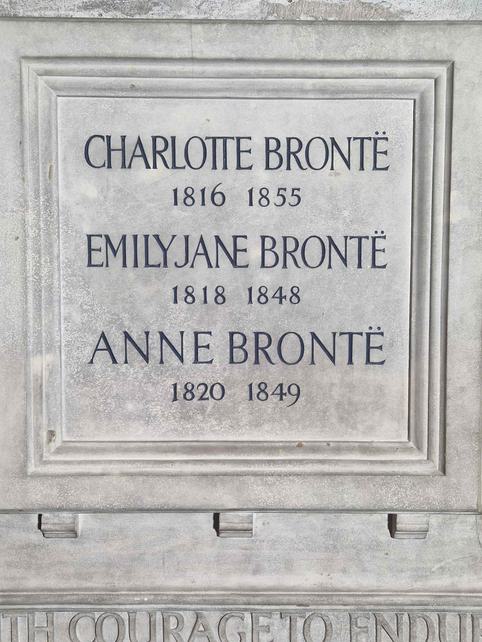Photo of a stone memorial to the Bronte sisters.