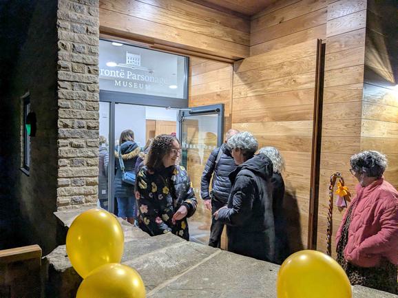 Visitors entering the new facilities building at the opening.