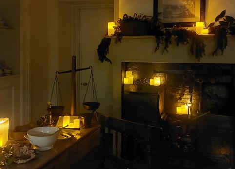 Photo of a candlelit room.